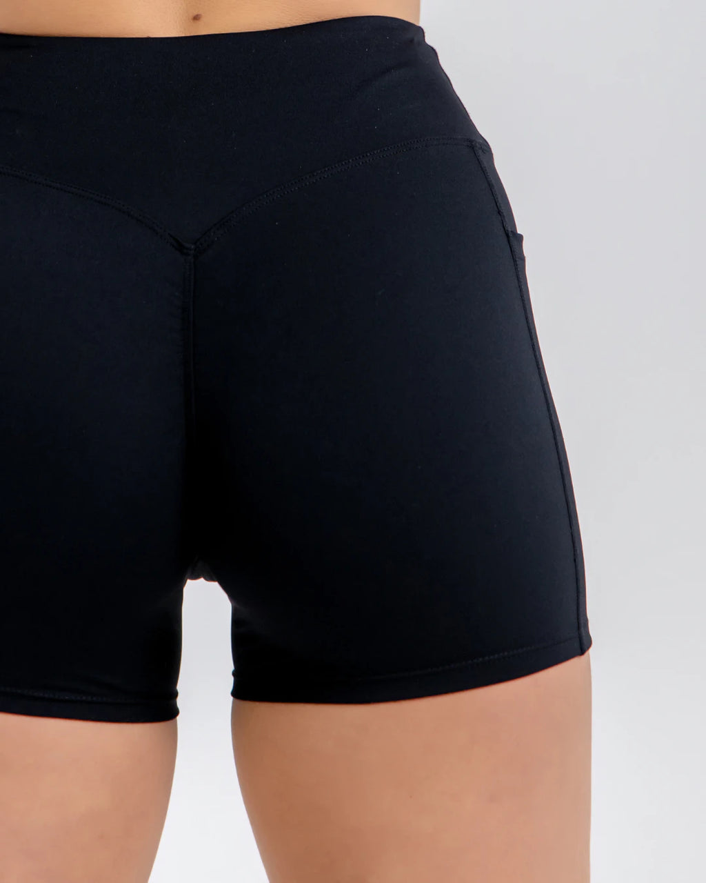 Vital Flow Pocket Shorts in Black Stealth, lightweight breathable activewear shorts with secure side pockets, designed for gym workouts, running, and everyday fitness training.